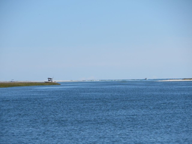 A glimpse of the ocean through an inlet
