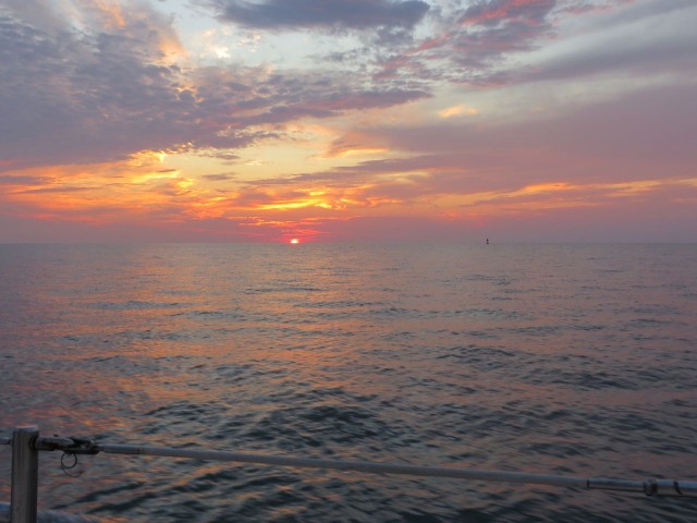 An offshore sunrise begins