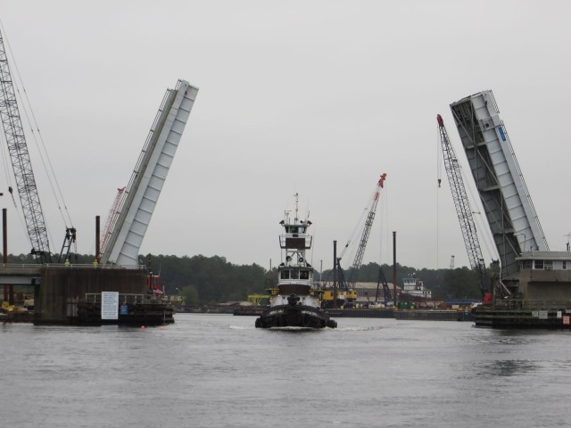 The tug comes through the bascule bridge first