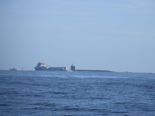 The escorting ship with the submarine