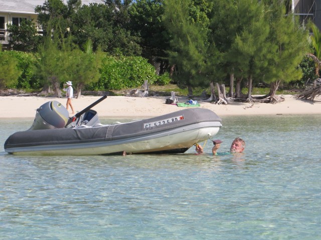 Al is always working on something! He just loves messing about in boats, large and small. Here he is scrubbing the dinghy's bottom.