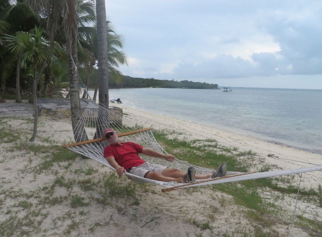 Al tests out the Grabbers' hammock on the beach at Fishers Bay.