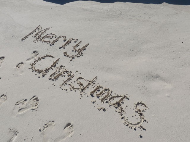 A "Merry Christmas" written in sand is as cheerful as one written in snow.