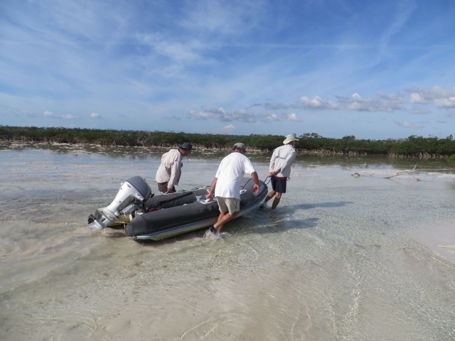 How many skippers does it take to carry a dinghy when the water is 4 inches deep?