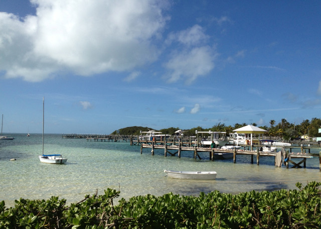 Such a pretty sight, looking out to the harbor. This Guana Cay dock is lined with conch shells.