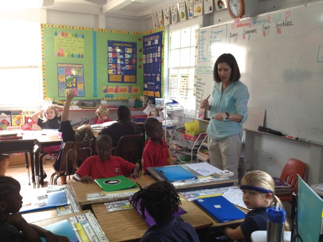 Miss Dee teaches 1st and 2nd graders in her classroom.