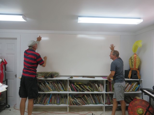 Al and Dan installing the whiteboard in the media center.