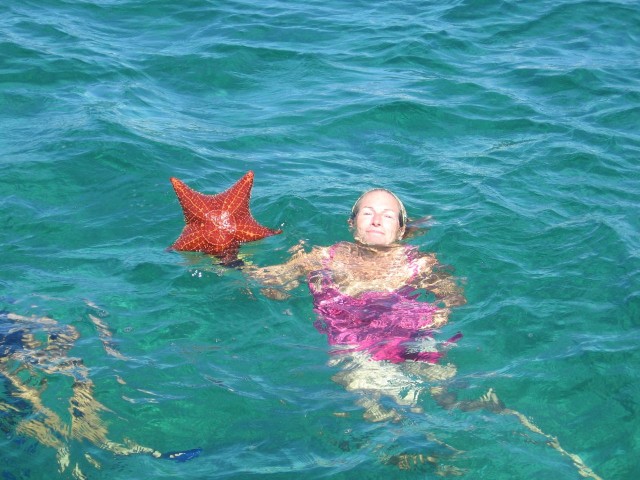 This is a ridiculous picture! Itreid so hard to hold the starfish up, but it was so heavy I would sink down before Judy could take a good photo.