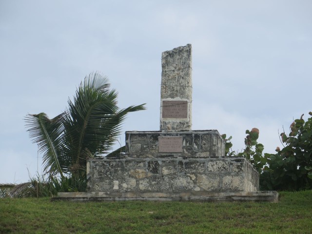 The Memorial Monument atop the hill, across form Wine Down Sip Sip, overlooking the ocean.