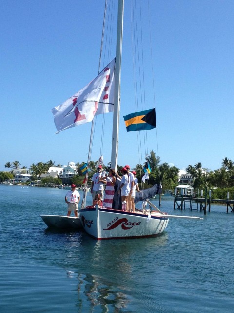 The Abaco Rage boat fitted out like the candy-striped lighthouse, wearing their racing team shirts.