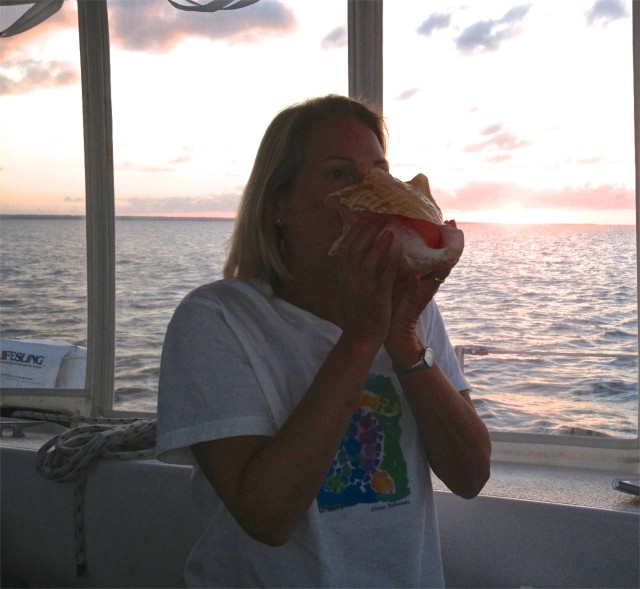 Announcing the setting sun with my conch horn. I really am improving, slowly.