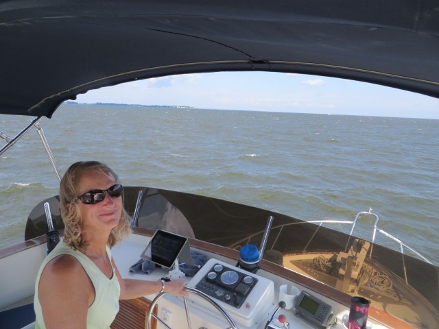 When we move up to the flybridge, I get to drive the boat. Windy day!