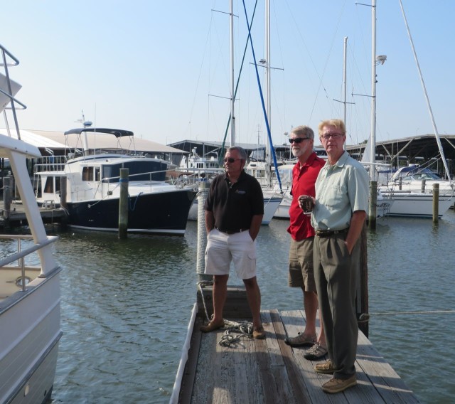 The men are waiting on the finger dock - John, the surveyor, Al and his brother Bill, our broker.