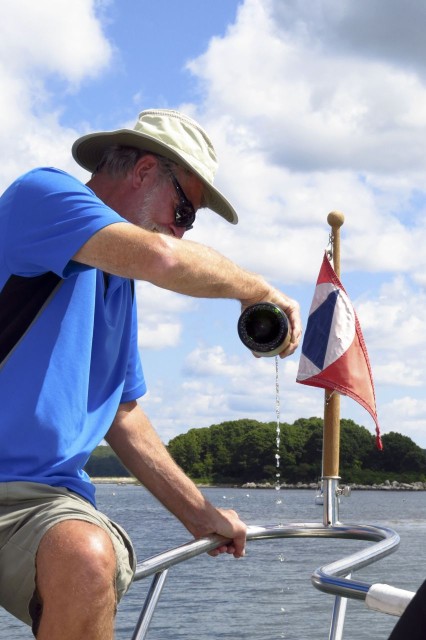 The Captain pours champagne over the bow while everyone toasts and salutes the new Kindred Spirit!