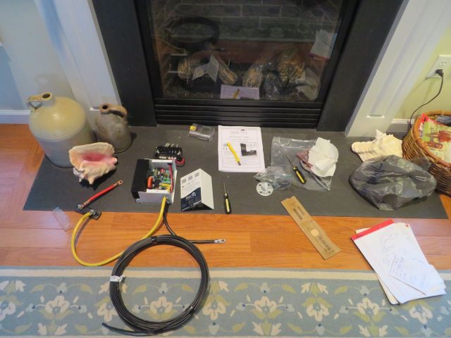 All the assorted wiring parts spread out in front of our fireplace 