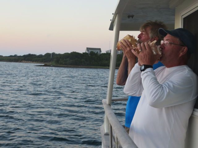 Al and Dean sound the conch horn at sunset. Yes, this is becoming quite a tradition.