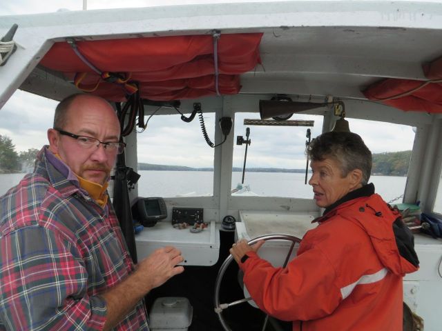 Laurie is at the helm while Peter prepares to haul traps up. Peter is the only one who can haul the traps since he has the license.