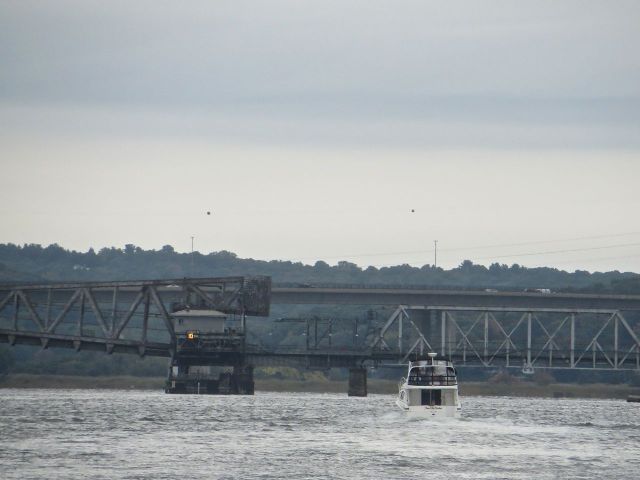 fast boat stopped at rr bridge