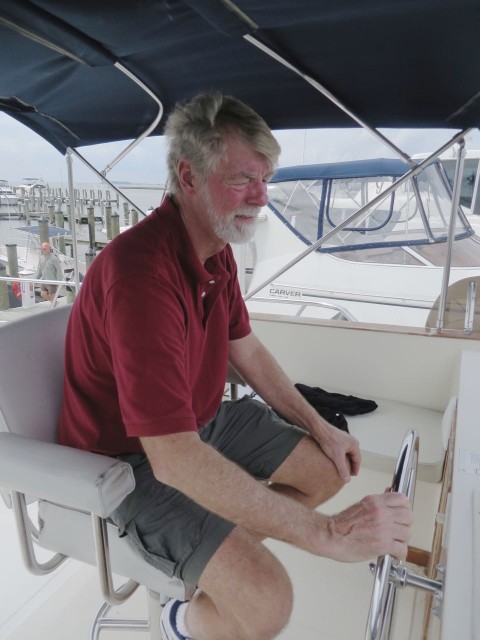 Al testing the steering during the survey, sitting on the single helm seat on the bridge.