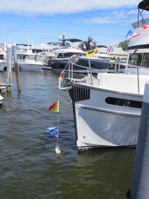 This is one way to dress a boat with signal flags and weigh them down. BU would you really leave the whiskey in the bottle?