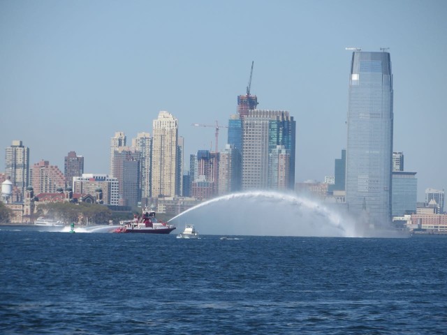 NYFD boat spraying a huge arc of water just past the Statue of Liberty. We were hoping it was a courtesy drive thru boat wash.