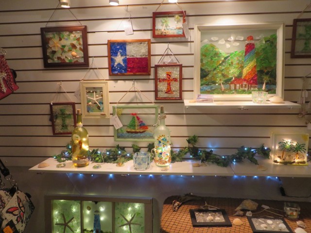 A display of sea glass art in al little shop. 