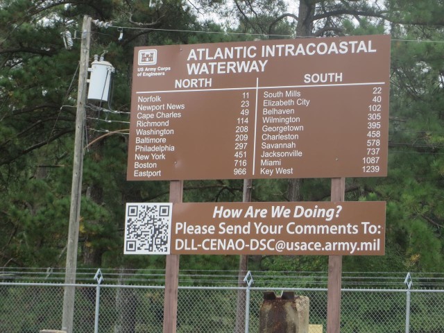 A mileage sign posted at the lock.