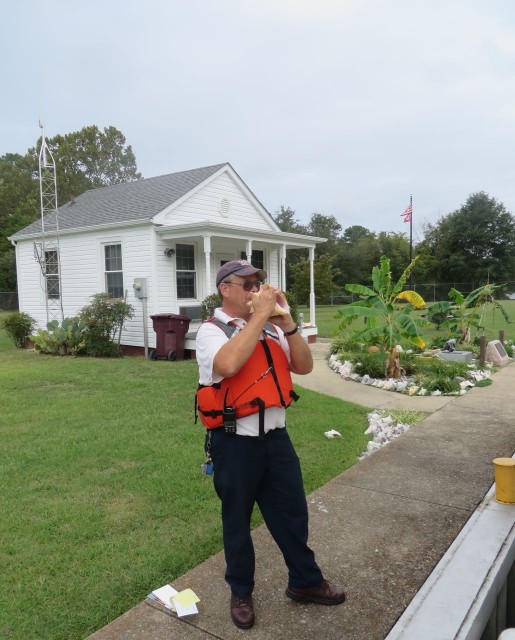 Robert has a LOT of conchs around the garden in front of his office. He took the time to demonstrate his conch horn blowing skill.