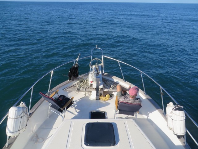 With autopilot and an open sea with nothing around for miles, we can both relax on the bow. What a great place that is ! And the interior helm controls are only steps away.