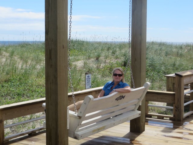 Enjoying the swing on the boardwalk.