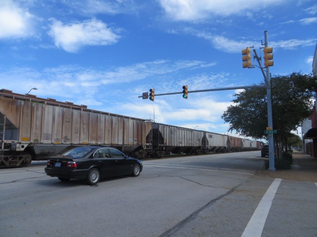 Now this was a surprise to me - trains run right down the middle of the main street, between the two lanes of cars!