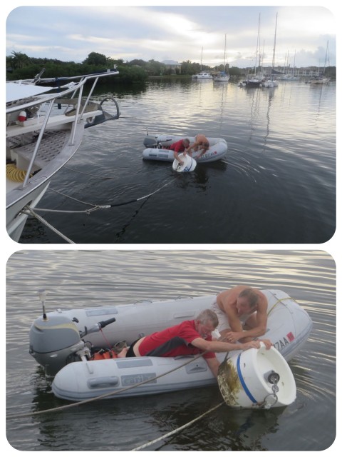 This problem is what we call "ball wrap." Over time, as boats swing about on a mooring the lines can get wrapped under the mooring ball. Al and Dan are untwisting it.