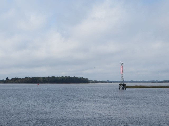 The final day of travel to Savannah was a short one and much less gray. The skies were finally brightening. This is the where the ICW enters the Savannah River.