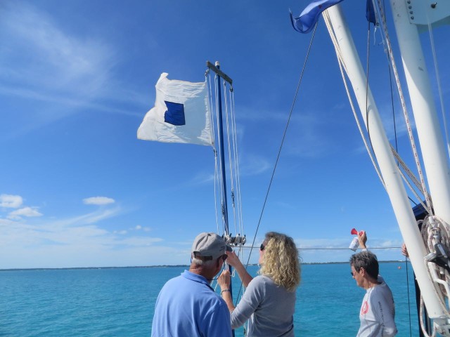 The S flag (S for shortening?) was hoisted to signal that the course has been shortened to end at start instead of including a final leg back to the mark near Johnny’s Cay. Of course, the horn was sounded and David also informed the boats on the VHF radio.