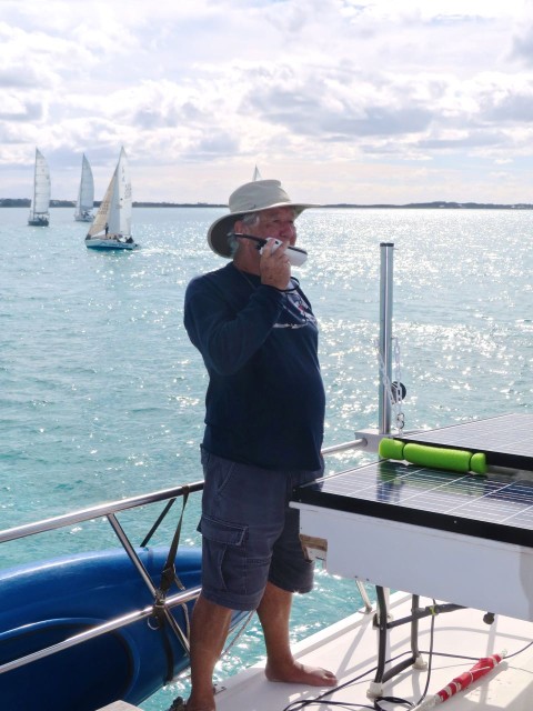 David speaks to the racing boats on the VHF radio.