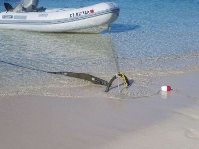 A dinghy, a Rocna, and a float on the sand. Not something we will see very often.