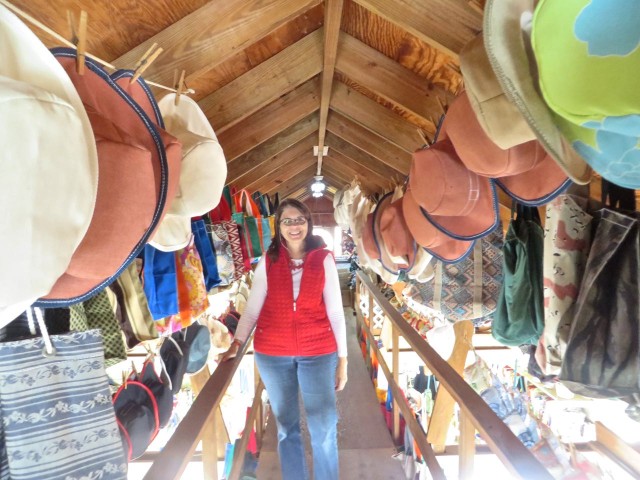 Annette in the loft of the "Sail Loft." We both enjoy visiting this shop and chatting with the ladies who sit and sew at their very ancient and durable sewing machines.