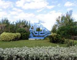 THE Treasure Cay graphic (same as on the welcome sign in the channel) in the center of the round-about. Yes - a roundabout! There were also little subdivisions of homes along the road.