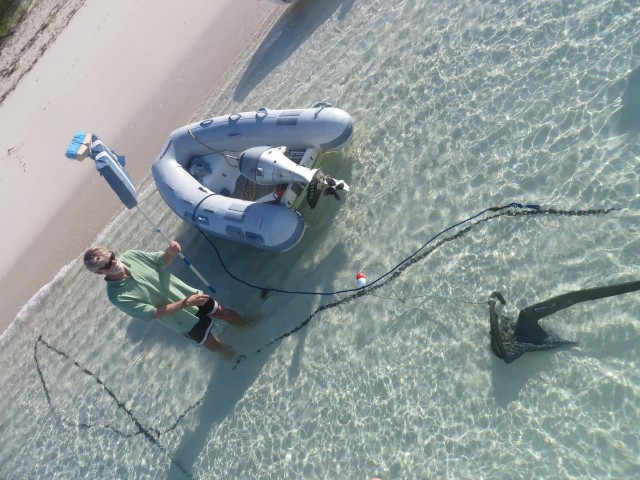 Looking down from the bow to see the rocna anchor, her little red and white float, and chain.