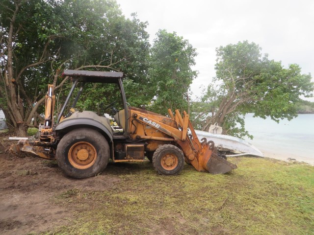 There was only one way to get this digger to the lot. Wait until low tide and drive it from the nearest “normal” road (the word normal is relative) onto the beach, on the beach until you reach John and Carol’s lot.