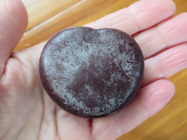 One in my hand, in its natural, newly found on the beach, condition.