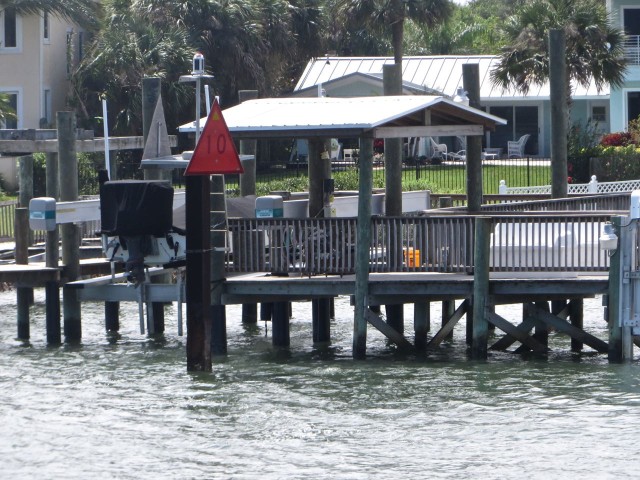 Monitoring the ICW markers are key to a successful passage, but this red triangle marker seemed very close to that dock.