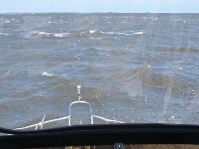 An attempted photo of our vigorous ride up the Cape Fear River. We were on the flybridge – photo taken through the closed plastic. I is easy to see how this river was named. In conditions worse than this, "fear" could be the word of the day. 