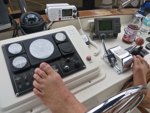 When we are on a straight path, the autopilot is usually steering the boat while we monitor and make adjustments. Al like to rest his feet on the helm, and because the autopilot is hydraulic, the steering wheel does not turn. Notice the shiny button to the right of his left foot?? That is the “STOP” button which will turn the engine off from the flybridge, something we have never done. It is spring-loaded and evidently Al’s foot touched it enough to begin the shutdown. Al quickly jumped up and slowed the speed down which is why the engine never fully quit. Good lesson with no painful consequences. Has he stopped resting his feet there? NOoooooo. Just more careful.