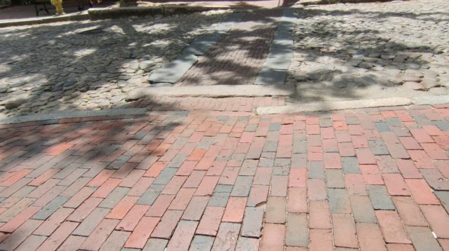 Streets of cobblestones and sidewalks of brick.