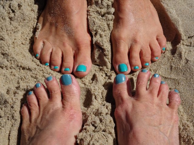 Mary Jo and I wiggle our teal toes in the sand.