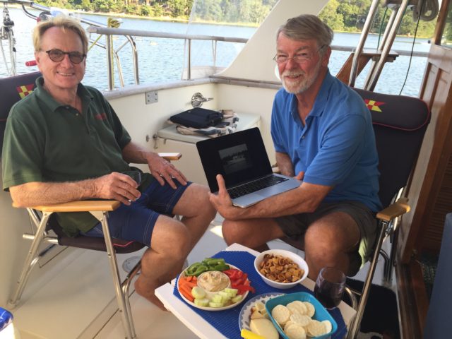 Colin and Al, discussing possible trawler options as we enjoy snacks and drinks.